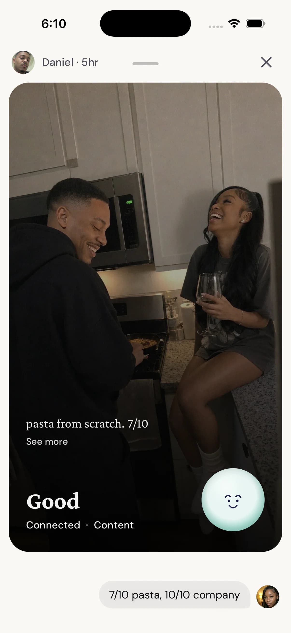 A partner's check-in opened full screen: a photo of the couple laughing in the kitchen, the note pasta from scratch, and the reply 7/10 pasta, 10/10 company.